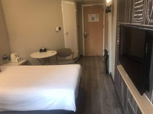 Imagen de la habitación del Hotel Ibis Shanghai Chengshan Road. Foto 8