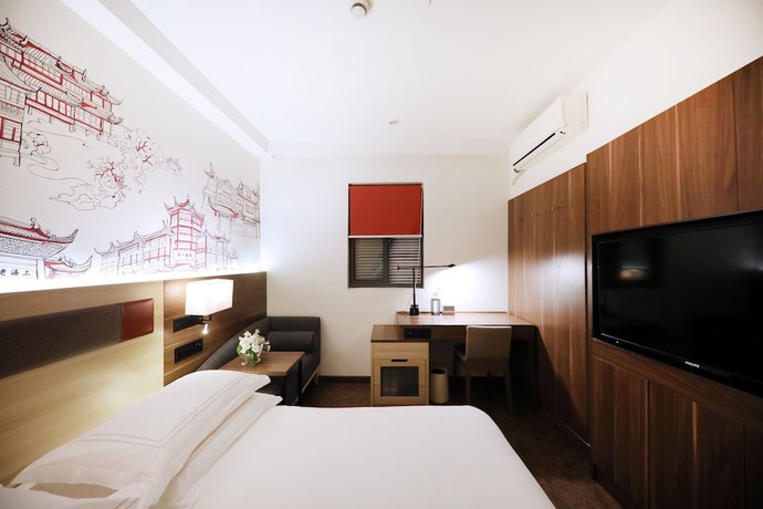 Imagen de la habitación del Hotel Ibis Shanghai Yu Garden. Foto 9