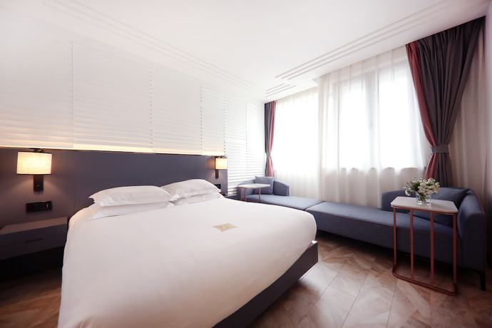 Imagen de la habitación del Hotel Ibis Shanghai Yu Garden. Foto 13