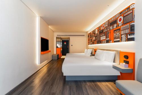 Imagen de la habitación del Hotel Ibis Styles - 260M from Guangji Street Subway Station. Foto 18