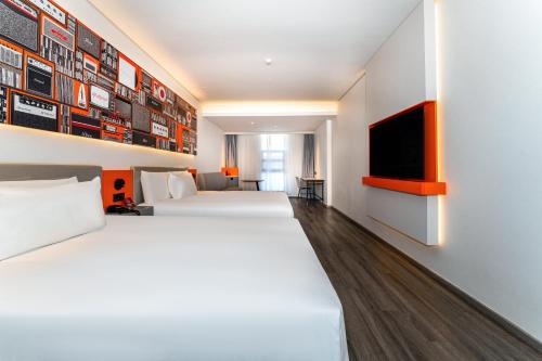 Imagen de la habitación del Hotel Ibis Styles - 260M from Guangji Street Subway Station. Foto 19