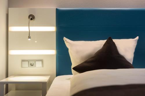 Imagen de la habitación del Hotel Ibis Styles Cologne Airport. Foto 4