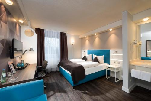 Imagen de la habitación del Hotel Ibis Styles Cologne Airport. Foto 7