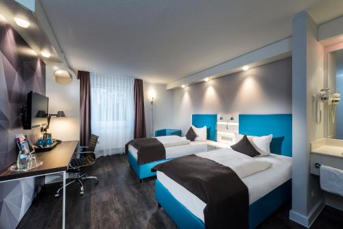 Imagen de la habitación del Hotel Ibis Styles Cologne Airport. Foto 8