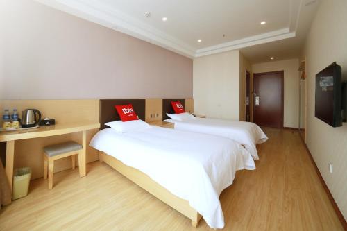Imagen de la habitación del Hotel Ibis Tianjin Wuqing. Foto 7