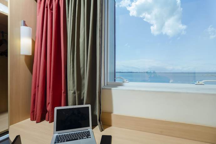 Imagen de la habitación del Hotel Ibis Vitoria Praia De Camburi. Foto 10