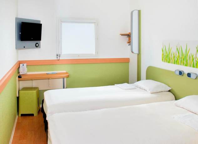 Imagen de la habitación del Hotel Ibis budget Clermont-Ferrand Le Brézet Aéroport. Foto 3