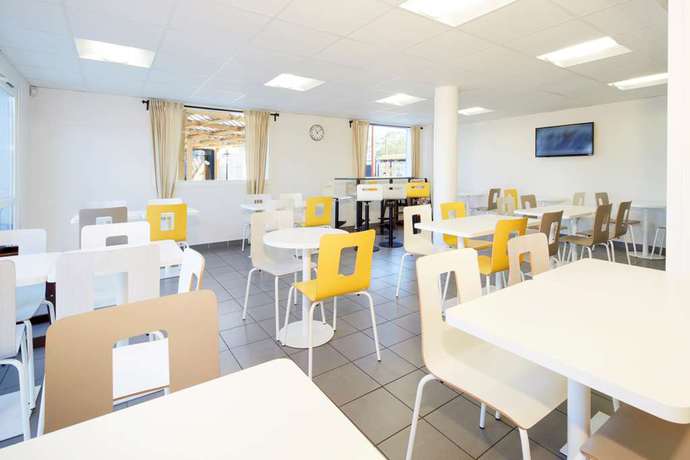 Imagen del bar/restaurante del Hotel Ibis budget Valence Nord Plateau des Couleures. Foto 2