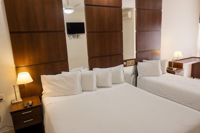 Imagen de la habitación del Hotel Ibituruna Center. Foto 15