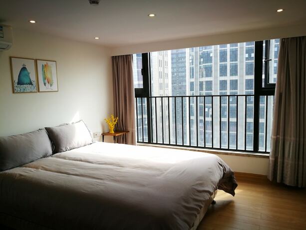 Imagen de la habitación del Hotel Ihouse Executive Apartment. Foto 18