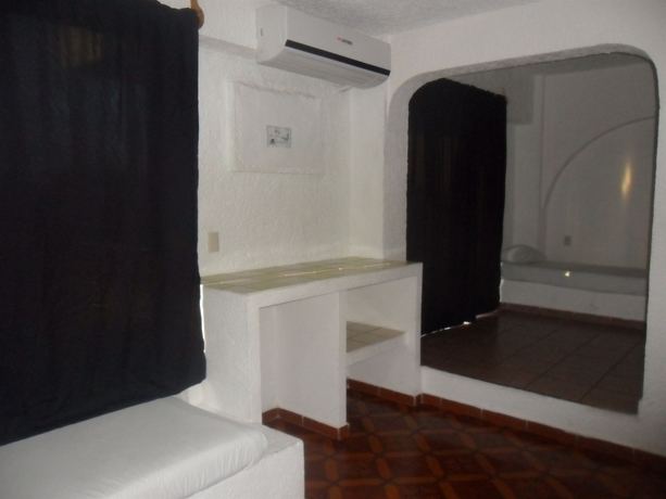 Imagen de la habitación del Hotel Ikaro Suites. Foto 5