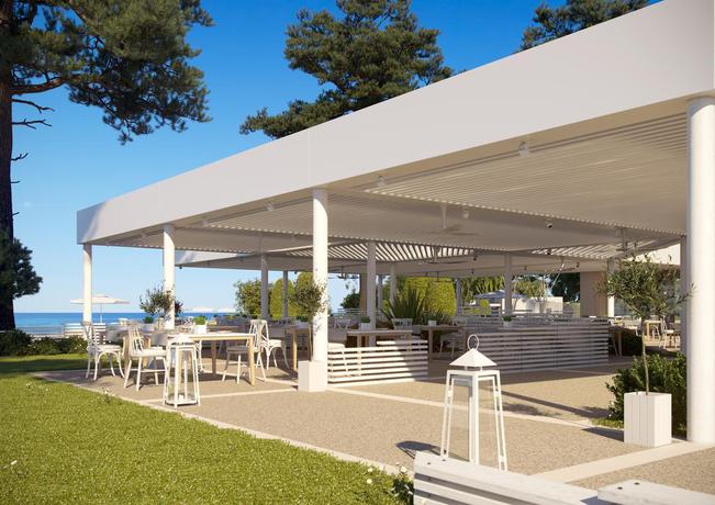Imagen del bar/restaurante del Hotel Ikos Dassia - All Inclusive. Foto 4