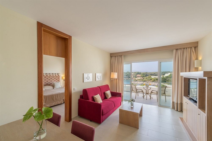 Imagen de la habitación del Hotel Ikos Porto Petro. Foto 8