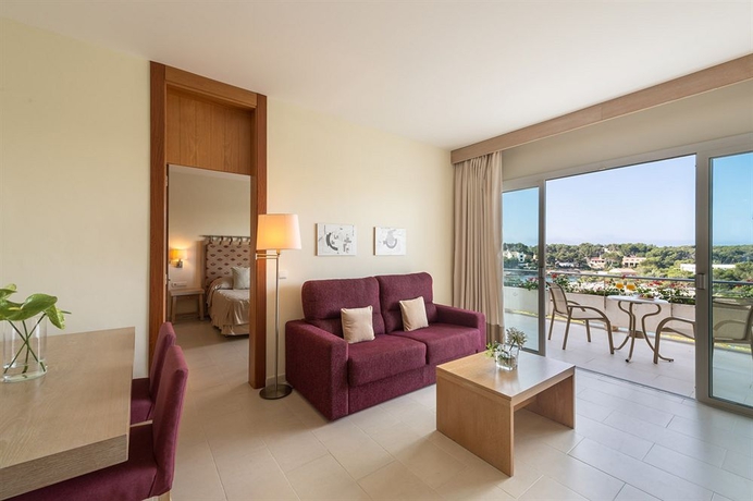 Imagen de la habitación del Hotel Ikos Porto Petro. Foto 9