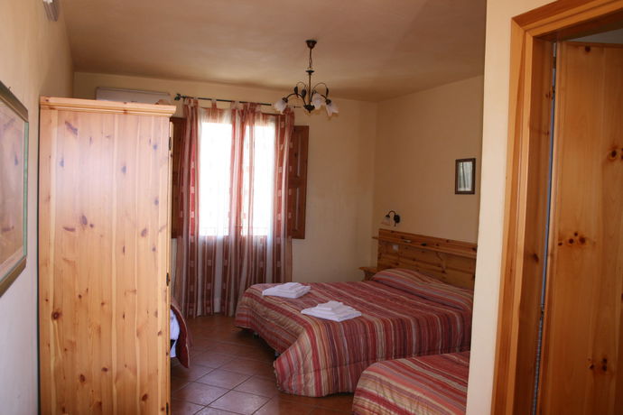 Imagen de la habitación del Hotel Il Cortile. Foto 8