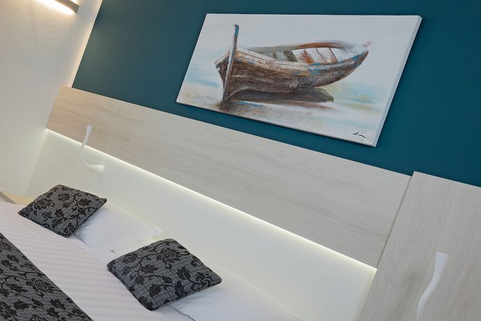 Imagen de la habitación del Hotel Il Delfino. Foto 11