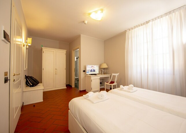 Imagen de la habitación del Hotel Il Gelso. Foto 16