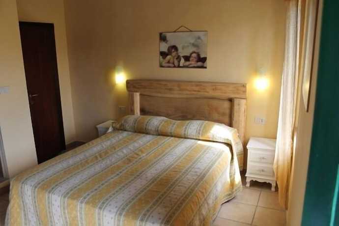 Imagen de la habitación del Hotel Il Girasole, Massignano. Foto 14