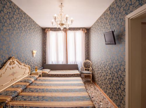 Imagen de la habitación del Hotel Il Mercante Di Venezia. Foto 23