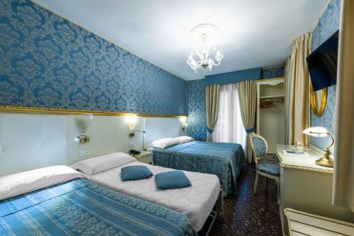 Imagen de la habitación del Hotel Il Mercante Di Venezia. Foto 25