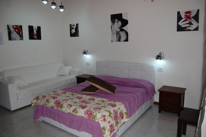 Imagen de la habitación del Hotel Il Mirto E La Rosa es. Foto 4