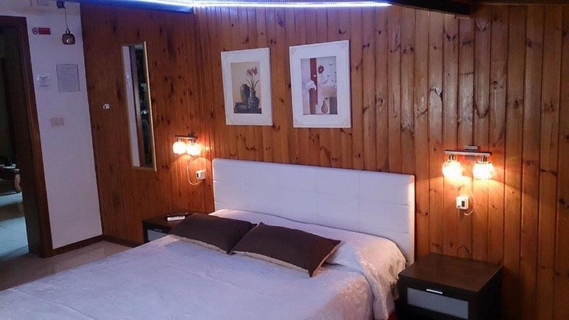 Imagen de la habitación del Hotel Il Mirto E La Rosa es. Foto 9