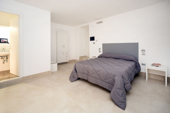 Imagen de la habitación del Hotel Il Tesoro Smart Suite and Spa. Foto 3