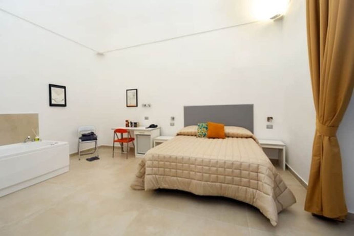 Imagen de la habitación del Hotel Il Tesoro Smart Suite and Spa. Foto 4