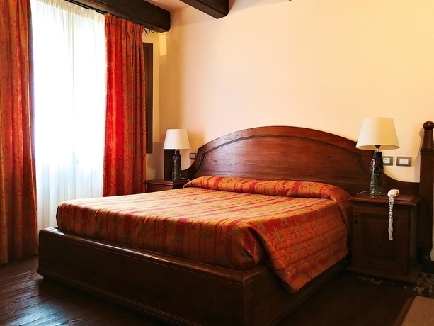 Imagen de la habitación del Hotel Il Vecchio Mulino. Foto 4