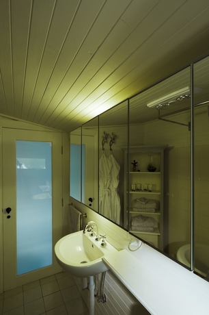 Imagen de la habitación del Hotel Illalangi Boutique Cottage. Foto 15