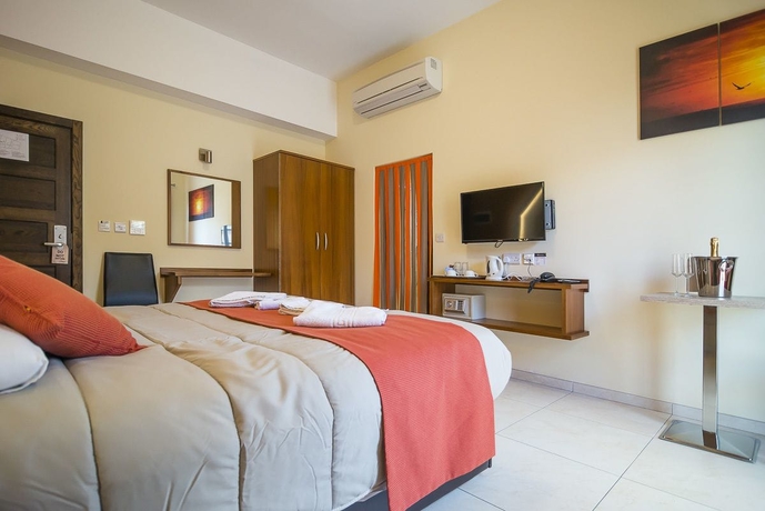 Imagen de la habitación del Hotel Il-logga Boutique. Foto 10