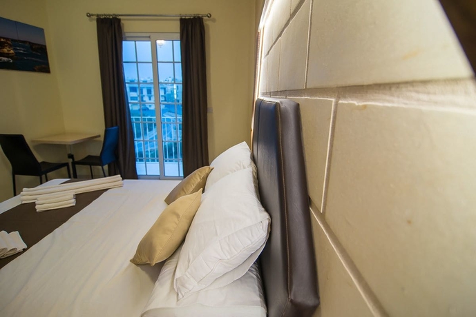 Imagen de la habitación del Hotel Il-logga Boutique. Foto 13