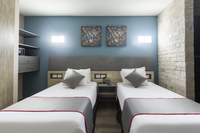 Imagen de la habitación del Hotel Illusion Xpress. Foto 7