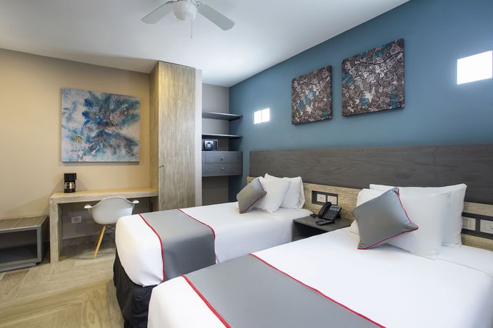 Imagen de la habitación del Hotel Illusion Xpress. Foto 11