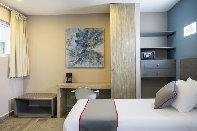 Imagen de la habitación del Hotel Illusion Xpress. Foto 13