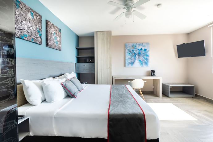 Imagen de la habitación del Hotel Illusion Xpress. Foto 14