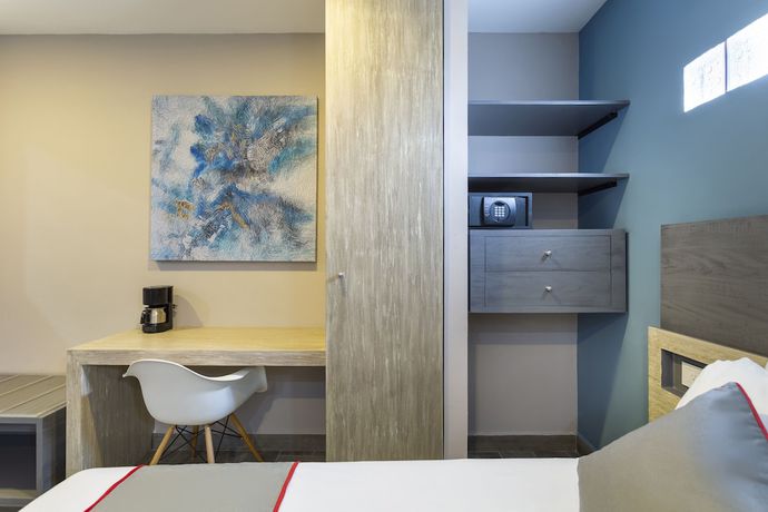 Imagen de la habitación del Hotel Illusion Xpress. Foto 15