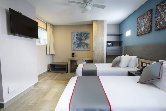 Imagen de la habitación del Hotel Illusion Xpress. Foto 16