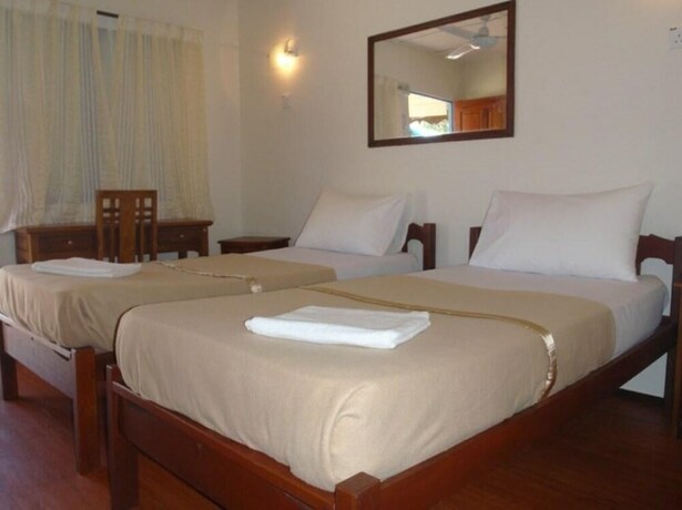 Imagen de la habitación del Hotel Impian Inn. Foto 15