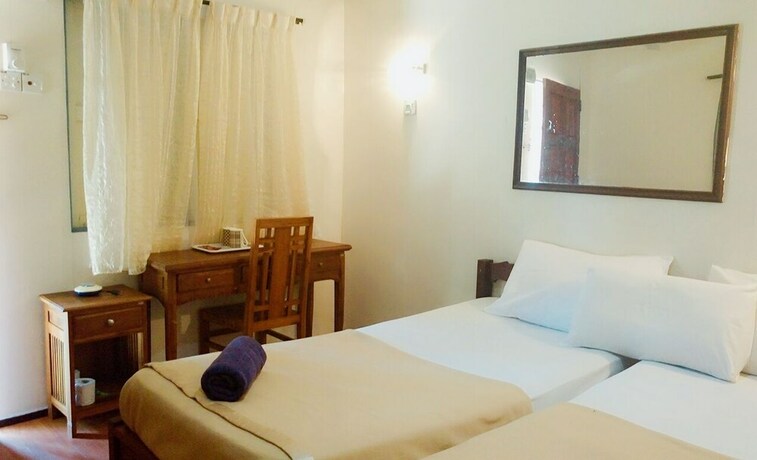 Imagen de la habitación del Hotel Impian Inn. Foto 16