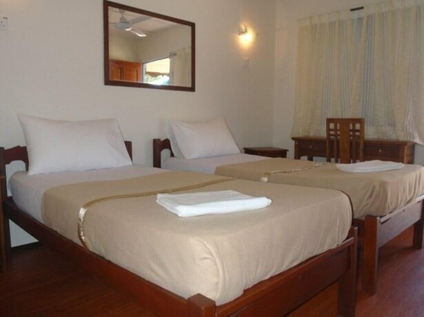 Imagen de la habitación del Hotel Impian Inn. Foto 17