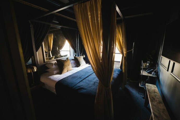 Imagen de la habitación del Hotel Impossible Motel. Foto 15