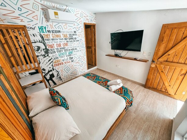 Imagen de la habitación del Hotel In Di House of Reggae Boutique. Foto 11