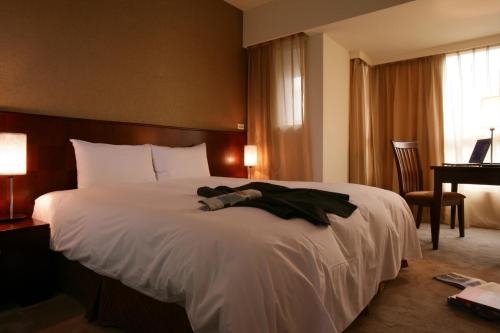 Imagen de la habitación del Hotel In One City Inn. Foto 8