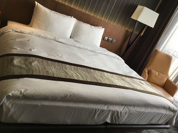 Imagen de la habitación del Hotel In, Pingzhen. Foto 3