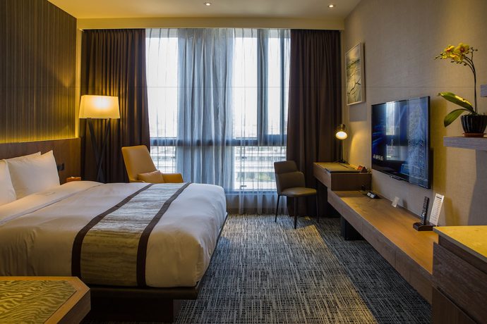 Imagen de la habitación del Hotel In, Pingzhen. Foto 5