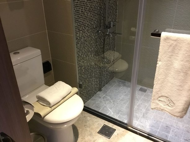 Imagen de la habitación del Hotel In, Pingzhen. Foto 7