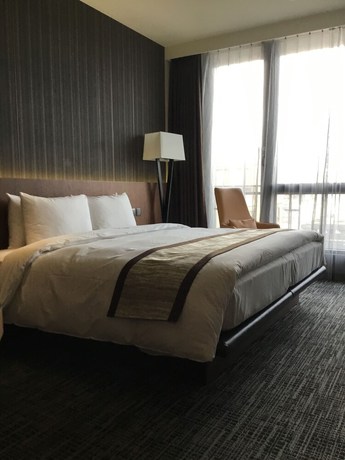 Imagen de la habitación del Hotel In, Pingzhen. Foto 8