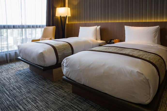 Imagen de la habitación del Hotel In, Pingzhen. Foto 9