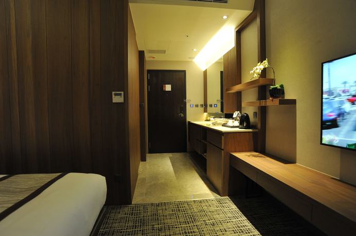 Imagen de la habitación del Hotel In, Pingzhen. Foto 11